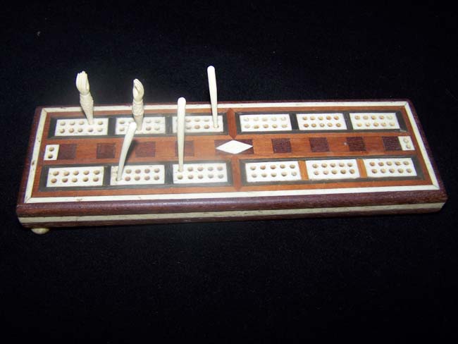 A 19th century Fruitwood Cribbage Board with ANTIQUE Whalebone Inlays